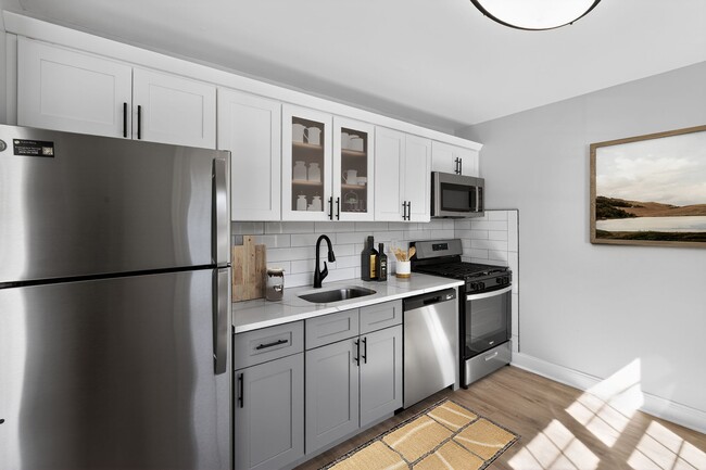 Unveil the modern charm of Eagle Rock Apartments at Woodbury. This stunning kitchen features sleek stainless appliances, elegant cabinetry, and ample space for culinary creativity. Elevate your living experience today—schedule a tour and see for yourself! - Eagle Rock Apartments at Woodbury
