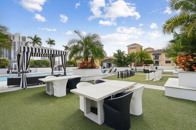 Rooftop lounge spaces with gaming and cabanas - AMLI Dadeland