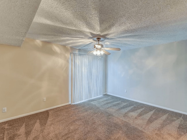 Bedroom with Ceiling Fan - The Club at Cherry Hills Apartments