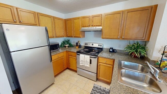 Kitchen with stainless steel appliances at Reserve at Brookhaven - The Reserve at Brookhaven