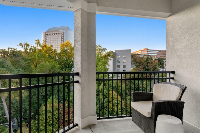 Relax and enjoy the serene city views from your private balcony. - Rowe Vinings