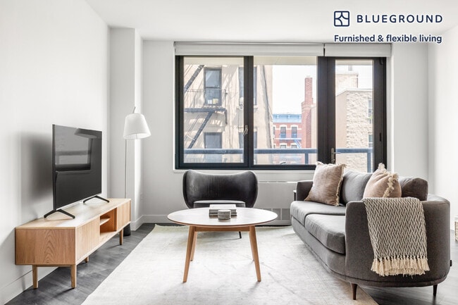 Building Photo - 250 E Houston St Unit FL4-ID889