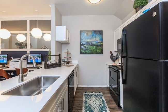 Resident kitchen and beverage bar - Apex Apartments