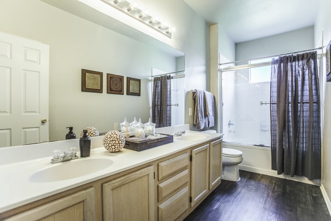 Bathroom with Upgraded Fixtures and Soaking Tub and Shower Combo - Legends at Chase Oaks