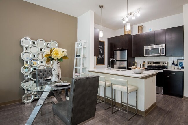 Open Floor Plan Dining and Kitchen Area - VV&M Apartments