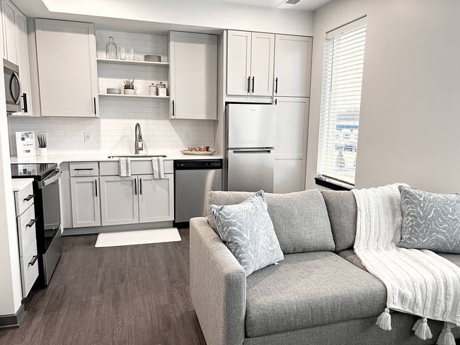Signature Model - Living & Kitchen.png - AYR Apartments