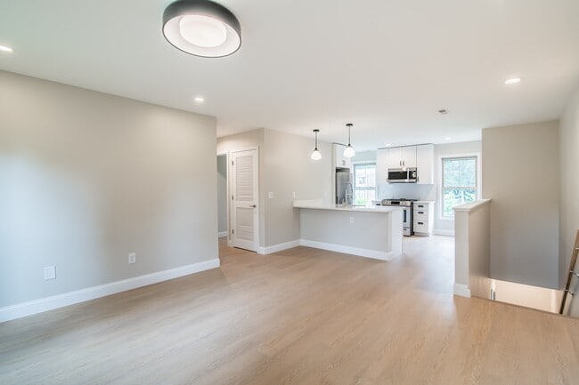 Welcome to Waterfront at the Strand, where modern living meets serene waterfront views. Enjoy spacious interiors, sleek finishes, and ample natural light. Don’t miss your chance to make this your new home! Schedule a tour today! - Waterfront at the Strand