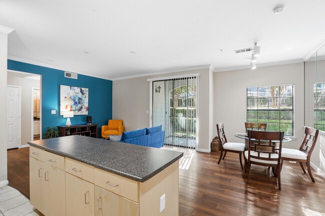 Large livingspace with large dining window and sliding pation door to create an open and bright space - Grand Estates at Kessler Park
