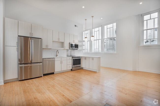 2BR, 2BA - 952SF - Living Room and Kitchen - The Belknap