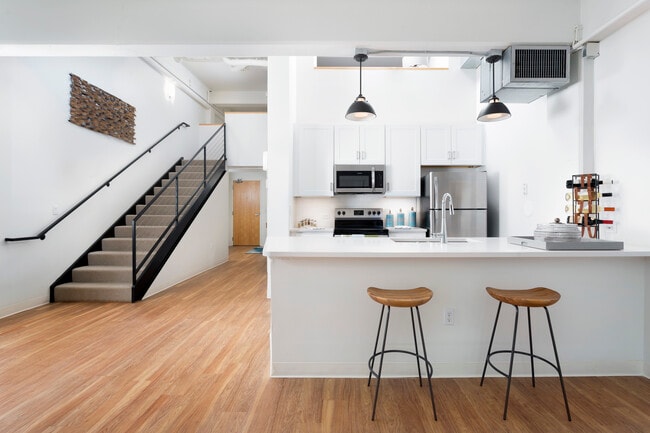 Renovated Unit Featuring Upgraded Lighting and LVT throughout the Kitchen and Living Room - Mission Grand