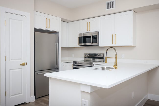 Quartz countertops, stainless appliances, and oversized island - Mistletoe Manor