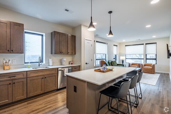 1BR, 1BA w/Den - 955SF - Kitchen and Dining Area - Leavenworth Lofts