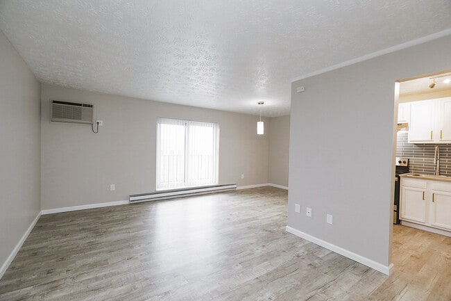 View of Living Room with Balcony doors - The Evalee Apartments
