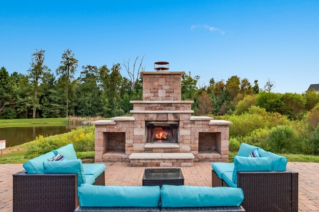 Lakeside fireplace with couch seating - Bridford West