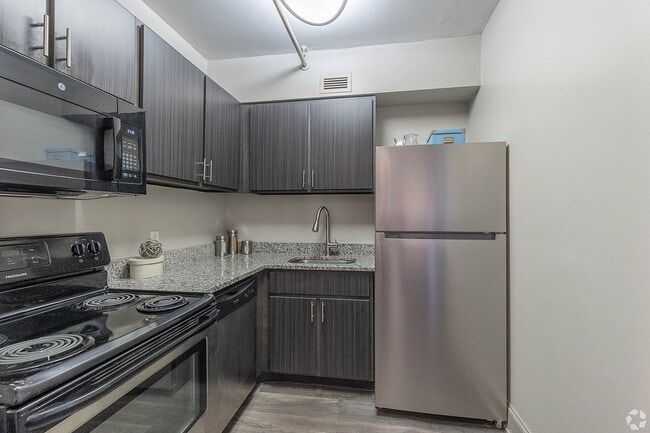Kitchen with granite counters and stainless appliances - 500 Fifth