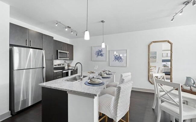 Contemporary Kitchen Featuring Granite Countertops and Pendant Lighting - The Landing at Vinnin Square