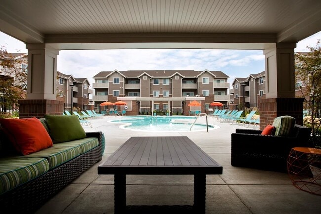 Bask in the serene atmosphere of SunStone at Fox Ridge, where modern elegance meets vibrant outdoor living. Enjoy relaxing by the sparkling pool and lush surroundings. Elevate your lifestyle today—schedule your tour now! - SunStone at Fox Ridge