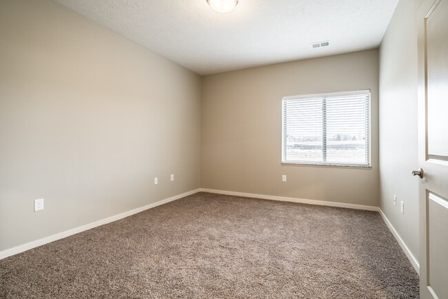 Our spacious bedrooms are filled with natural light. - The Villas at Falling Waters