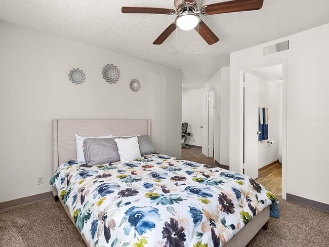 Bedroom with Ceiling Fan - Mesa Ridge Apartments