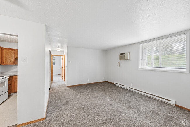 2BR, 1BA - 665SF - Living Room - St. Charles Court Apartments