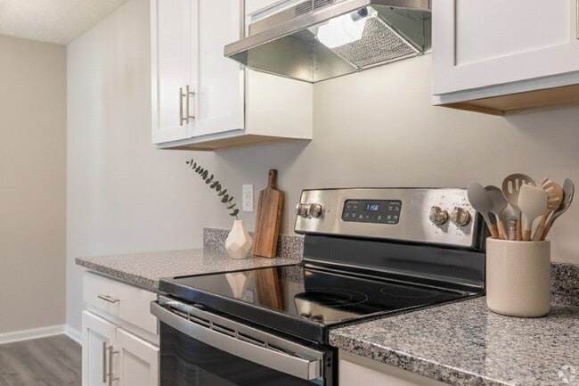 Modern Kitchen with Granite Countertops and Stainless Steel Appliances - Hidden Lake