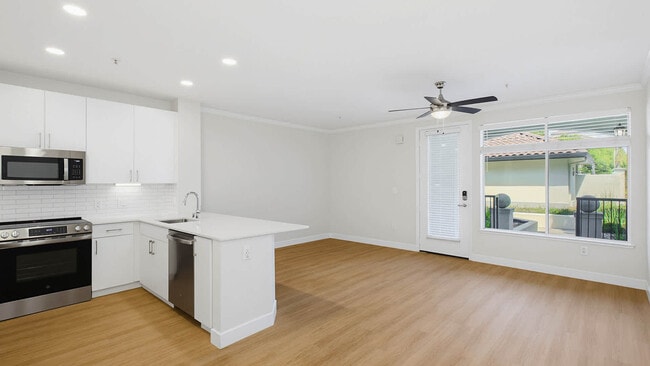 Kitchen with Stainless Steel Appliances - Park Place at San Mateo