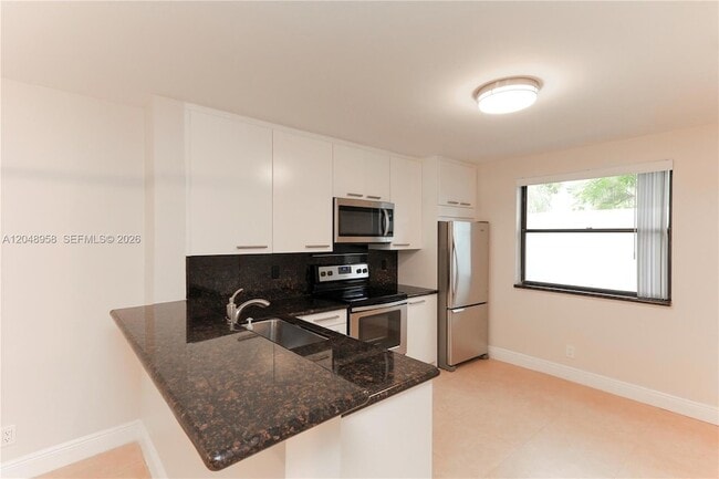 Building Photo - 10125 W Sunrise Blvd Unit 101