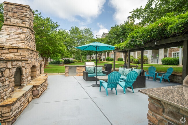 Courtyard with BBQ's - The Heights At Towne Lake