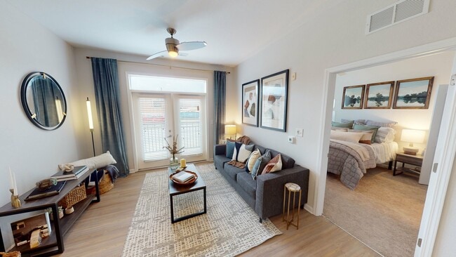 Open-Concept Living Room and Cozy Bedroom at Ralston Apartments in Downtown Indianapolis - Ralston Apartments