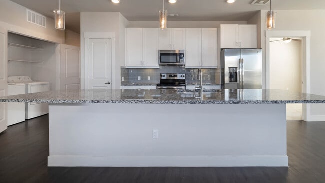 Kitchen with Granite Countertops and Stainless Steel Appliances - Venue at the Promenade