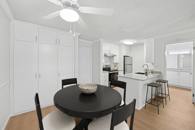 Renovated Package I kitchen and dining area with hard surface flooring - eaves West Valley