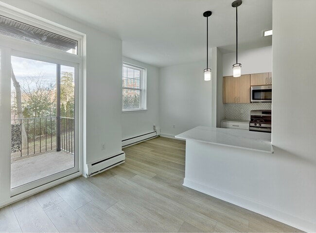 Enjoy natural light, modern finishes, and private balcony access at Crestwood Apartments in Wayne, PA - Crestwood