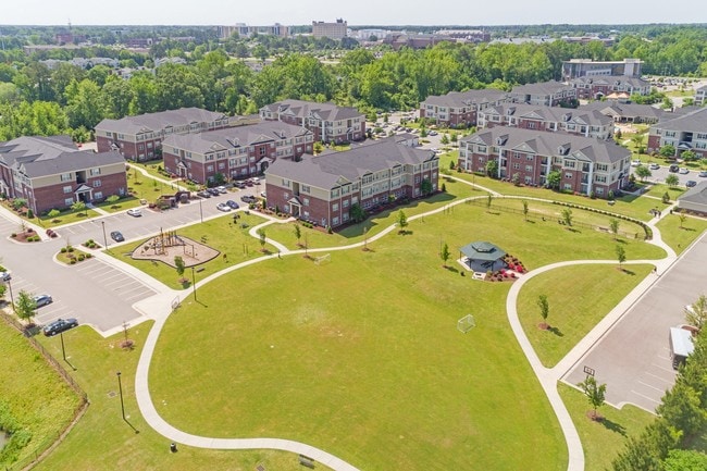 Community Park with Playground, Dog Park, and Walking Trail - The Heritage at Arlington Apartment Homes