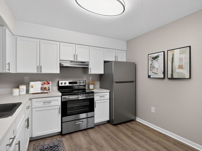 Welcome to The Residences at Talcott, where modern design meets convenience. Our spacious kitchens feature stainless steel appliances and sleek finishes, perfect for culinary enthusiasts. Elevate your lifestyle today—schedule a tour now! - The Residences at Talcott, an Eagle Rock Community