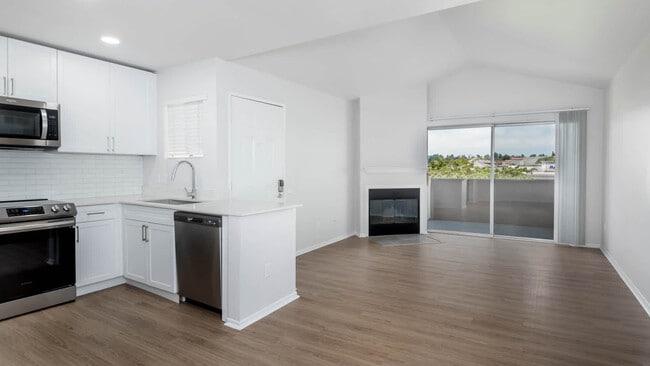 Living Room with Fireplace and Balcony - Carmel Terrace