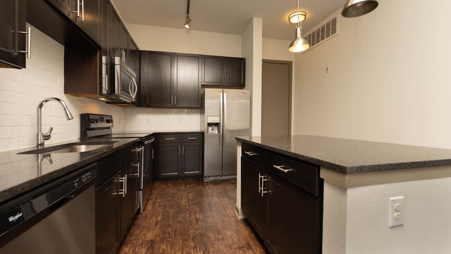Kitchen with Stainless Steel Appliances - Crest at Park Central