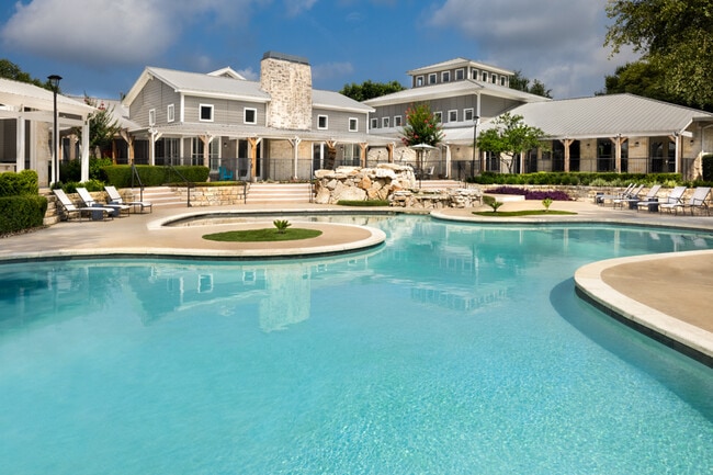 Resort-styled swimming pool with sun deck - The Ranch Apartments