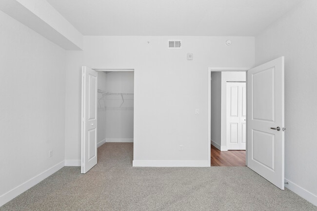 Retreat to a bedroom built for relaxation. - Milano Lakes