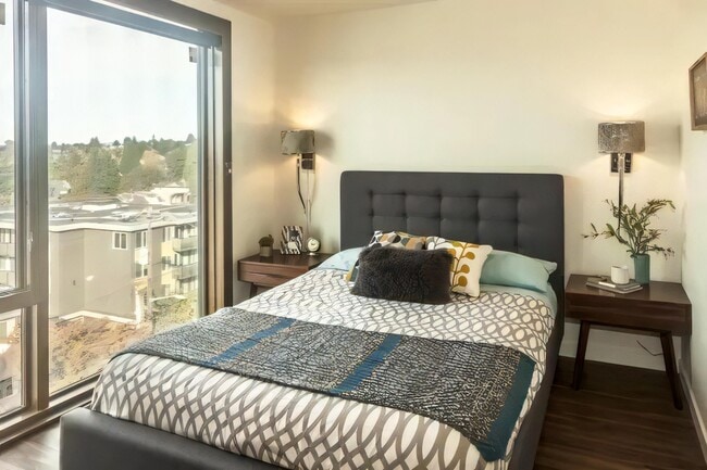 Glass wraps the corner, so the room takes light from two directions. - Ballard Lofts