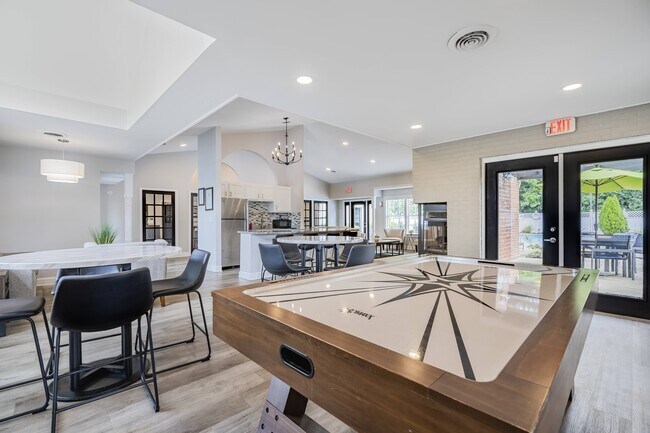 Meet neighbors and friends in the game room. - The Oaks
