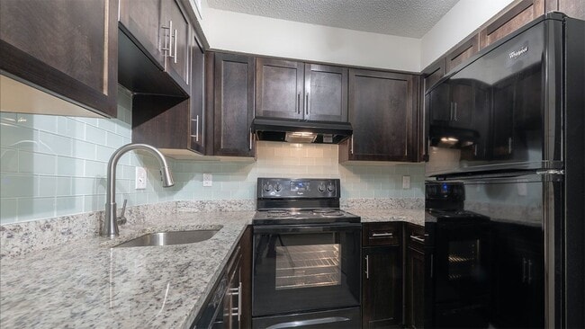 Open kitchens designed for both style and functionality. - Amberlake Village