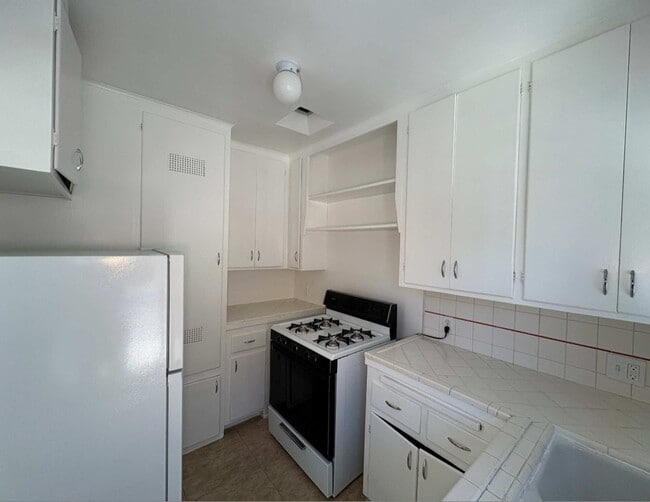 kitchen has backdoor exit - 15912 W Sunset Blvd