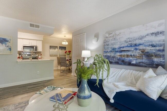Living Room with view of dining area - Brixton McKinney Apartments