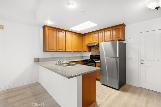 Building Photo - 17888 Alburtis Ave Unit A102-2