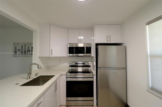 Building Photo - 9300 Lime Bay Blvd Unit 102