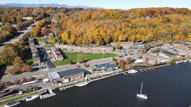 Welcome to Waterfront at the Strand, where picturesque lake views and vibrant fall foliage create a stunning backdrop. Enjoy modern amenities and a welcoming community. Don't miss your chance to call this beautiful place home—schedule a tour today! - Waterfront at the Strand