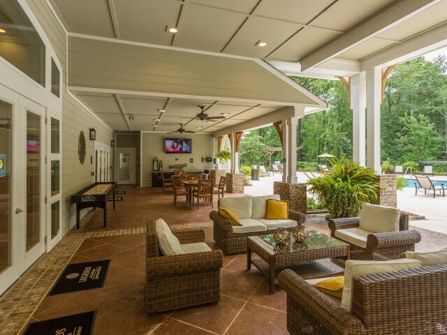Covered entertainment area with outdoor kitchent - Legends at Azalea