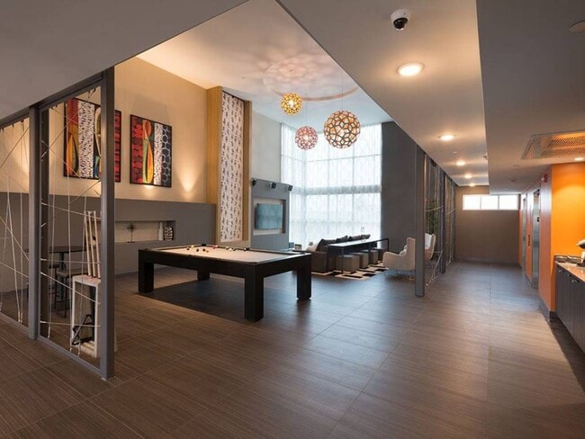 Tenants can enjoy a game of pool 24/7 in our Lobby. - Celsius Apartments