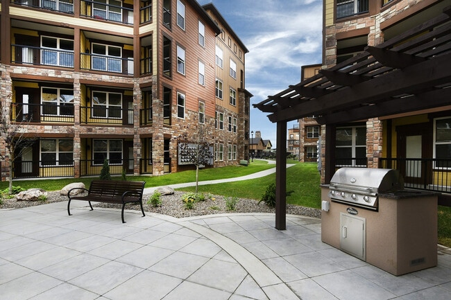 Enjoy sunny afternoons and great meals at our beautiful grill station. - Watermark at Jordan Creek