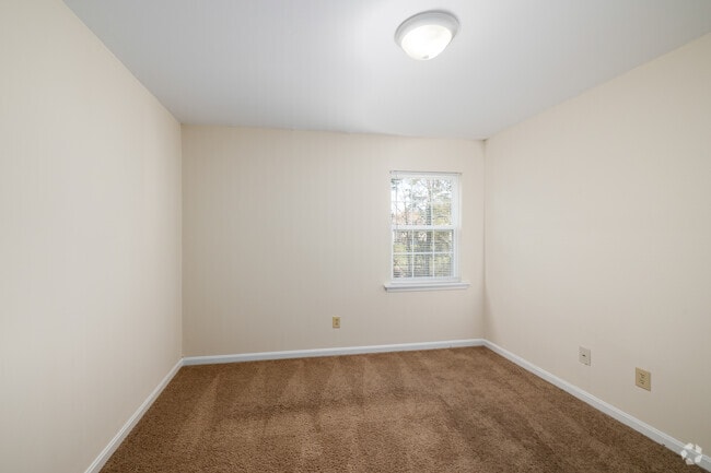 2BR, 1BA - 875SF - Primary Bedroom - Woodscape Apartments